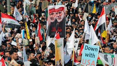 Supporters of the Popular Mobilisation Forces gather to mark the anniversary of the killing of Iranian military Qassem Suleimani and Iraqi militia leader Abu Mahdi Al Muhandis. Reuters