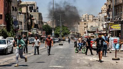 Smoke from a barricade of burning tyres rises during an Israeli army raid at Al Ain camp, west of Nablus. AFP