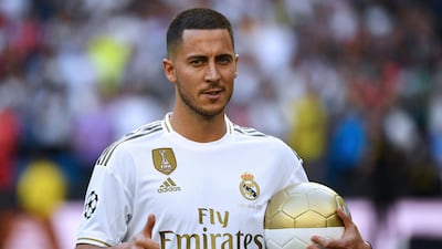 Eden Hazard poses for photos inside the Santiago Bernabeu. AFP