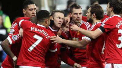 Manchester United's Wayne Rooney, centre left, celebrates scoring their third goal against Newcastle with teammates during their Premier League match at St James' Park in Newcastle, Britain, 12 January 2016. EPA/LINDSEY PARNABY