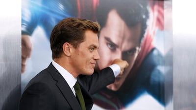 Michael Shannon, who plays General Zod the bad-guy of Man of Steel, pretends to punch a Superman poster as he arrives for the world premiere of the film. Lucas Jackson / Reuters