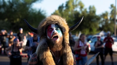 A person reacts to Black Lives Matter protesters who arrived at a rally against restrictions to prevent the spread of coronavirus, in Phoenix, Arizona, US. Reuters