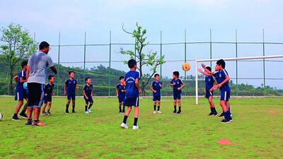 Children practise their footballing skills at the Sahara Football Academy in Pokhara, Nepal. The centre, which opened in 1998, trains and educates children from families that are unable to support them. Bibek Bhandari for The National