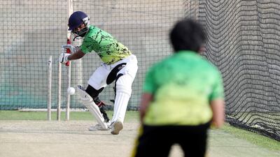 Ryan Paramasivam bats in the nets as cricket training returns at Its Just Cricket academy in Jebel Ali. Chris Whiteoak / The National