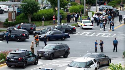 Police officers in the Maryland capital city of Annapolis responded within minutes to a 911 call about a shooting in progress at the offices of the Capital Gazette newspaper group and apprehended the suspect hiding under a desk, authorities said. Jose Luis Magana / AP Photo