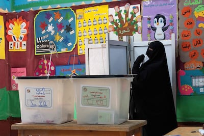 A voter prepares to cast her ballot at a polling station in Giza during the first phase of Egypt's parliamentary election on November 10. AFP