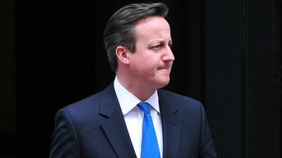 The British prime minister David Cameron waits for the arrival of the Italian premier, Matteo Renzi, in Downing Street on April 1, 2014. Mr Cameron's office said he had ordered a review of the Muslim Brotherhood's activities in the country. Carl Court / AFP