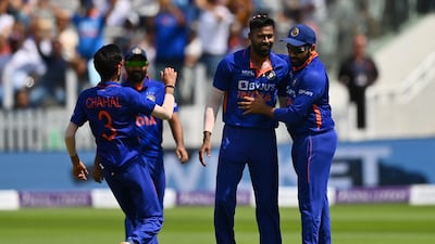 Hardik Pandya, second right, celebrates after taking the wicket of England opener Jason Roy. Getty