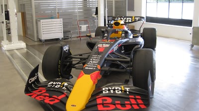 Previous years' cars in the workshop for the team's heritage programme. Photo: Daniel Bardsley for The National