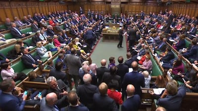 A video grab from footage broadcast by the UK Parliament's Parliamentary Recording Unit (PRU) shows MPs filing back into the House after voting on the third reading of the European Union Withdrawal No 6 Bill, a bill to delay Brexit for three months, in the House of Commons in London on September 4, 2019 AFP