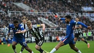 Newcastle United's Lewis Hall, centre, vies with Chelsea defenders Wesley Fofana, left, and Reece James. AFP
