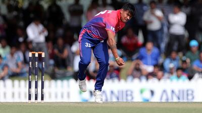 Karan KC of Nepal bowls. Chris Whiteoak/The National