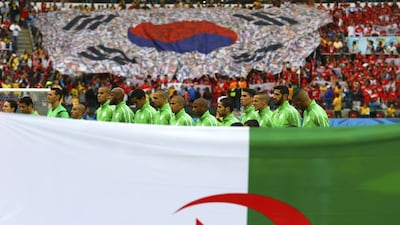 Algeria players stand before the 2014 World Cup Group H match against South Korea on Sunday in Porto Alegre, Brazil. Damir Sagolj / Reuters