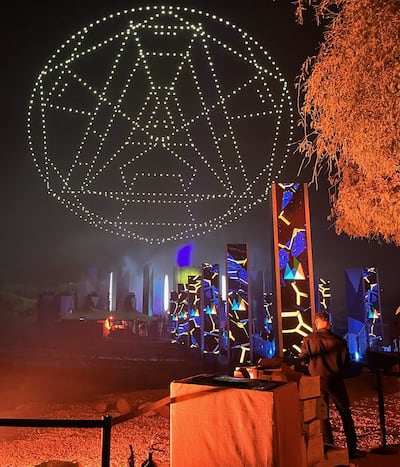 Drones come together to make an A-symbol during Pillars of Creation. Evelyn Lau / The National
