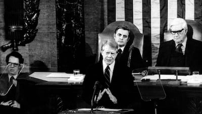 Former US president Jimmy Carter gives a speech as then-vice president Mondale looks on. AFP
