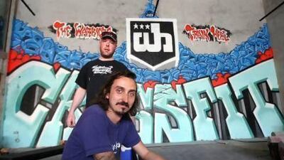 Shaun Sepr, front, and Tom Deams with their Crossfit graffiti at the Warehouse gym in Dubai. Pawan Singh / The National