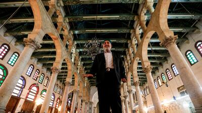 Inside the Syrian capital's Great Umayyad Mosque, six muezzins sit before a loudspeaker, collectively reciting the call to prayer. AFP