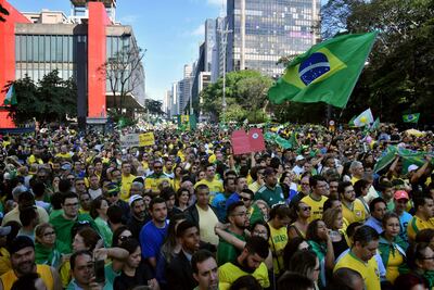 Supporters of Jair Bolsonaro take part in a rally. Nelson Almeida / AFP