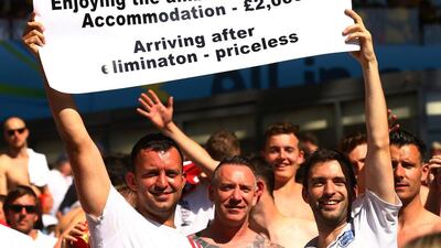 England fans hold up a sign during their team's match against Costa Rica on Tuesday at the 2014 World Cup in Belo Horizonte, Brazil. Richard Heathcote / Getty Images