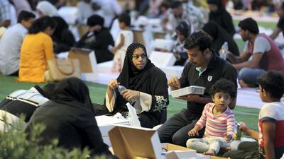 People breaking their fast on the first day of Ramadan at the Sheikh Zayed Grand Mosque in Abu Dhabi. Pawan Singh / The National