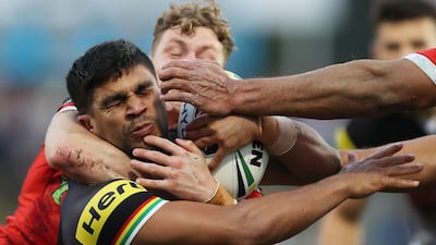 Tyrone Peachey of the Penrith Panthers is tackled by Kurt Mann of the St George Illawarra Dragons during their NRL match in Sydney. Mark Metcalfe / Getty Images