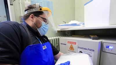 A pharmacy technician from Croydon Health Services takes delivery of the first batch of Covid-19 vaccinations at Croydon University Hospital in south London. AFP
