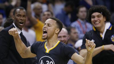 Golden State Warriors guard Stephen Curry (30) celebrates after hitting the game-winning shot in overtime of an NBA basketball game against the Oklahoma City Thunder in Oklahoma City, Saturday, Feb. 27, 2016. Golden State won 121-118. (AP Photo/Sue Ogrocki)