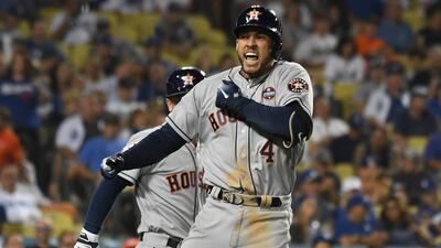 The Astros' George Springer celebrates his two-run homer in the 11th inning against the Dodgers. Richard Mackson / Reuters