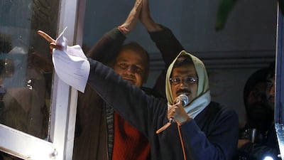 Delhi's Chief Minister Arvind Kejriwal waves his resignation letter in front of supporters at Aam Aadmi (Common Man) Party offices. A readers suggests his stand in a principled one that will in time be rewarded electorally. AFP