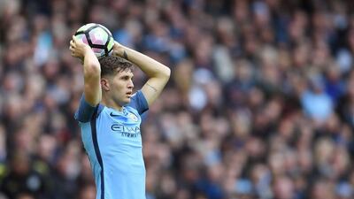 John Stones of Manchester City takes a throw-in. Laurence Griffiths / Getty Images