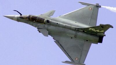 This June 21, 2001 file photo shows a French Air Force Rafale manufactured by France's Dassault Aviation speeding above Le Bourget airport, north of Paris, France, during the 44th Paris Air Show. AP