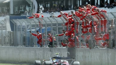 Ferrari team members celebrate driver Lewis Hamilton's victory in the Catalonia Formula One Grand Prix, on the outskirts of Barcelona. AFP