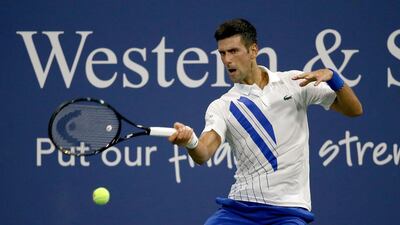 Novak Djokovic of Serbia returns a shot to Ricardas Berankis of Lithuania during the Western & Southern Open. AFP