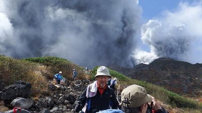 Climbers descend Mt Ontake, which straddles Nagano and Gifu prefectures. Kyodo News / Reuters