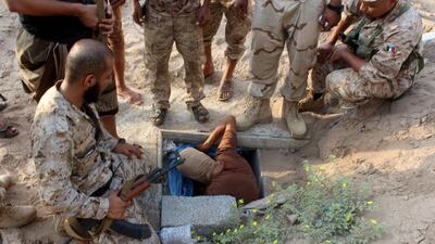 Yemeni security forces check an underground storage in Ja'awla a northern neighbourhood of Aden which was reportedly used by rebels to store weapons and ammunition on August 16, 2016. / AFP / SALEH AL-OBEIDI