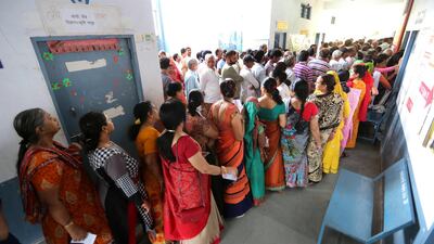 Indian voters wait in queues to cast their votes at a polling station during the sixth phase of the Indian parliamentary election in Bhopal, India. EPA