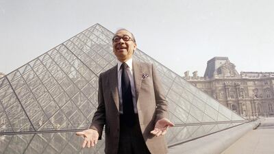 Pei laughs while posing for a portrait in front of the Louvre glass pyramid in 1989. AP Photo