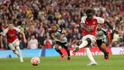 Bukayo Saka scores from the spot for Arsenal. Getty