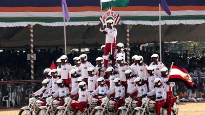 The army's ASC Tornadoes daredevil bike team performs in Bangalore. Jagadeesh NV / EPA