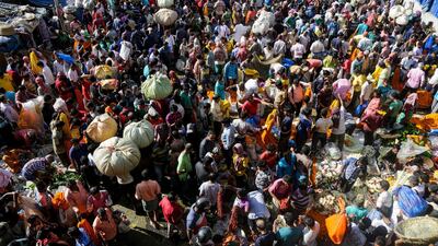 Buyers and sellers throng a wholesale flower market on the occasion of Hindu festivals Kali Puja and Diwali, in Kolkata, India. AP
