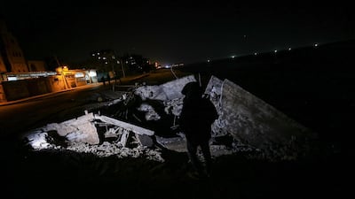 A Palestinian man inspects the rubble of destroyed sewage pipes after an overnight Israeli air strike at al Shatea-a refugee camp in Gaza City. EPA
