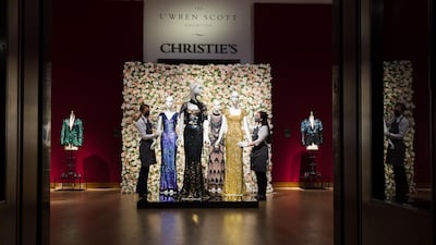 A gold sequined gown worn by Penelope Cruz (R) and a blue sequinned evening gown worn by Daphne Guinness. EPA/Vickie Flores