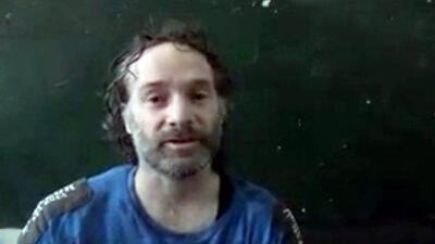 In this image made from undated video obtained by The Associated Press, Peter Theo Curtis, a US citizen held hostage by an Al Qaeda-linked group in Syria, delivers a statement. The US government said on Sunday, August 24, 2014 that Mr Curtis, who had been held hostage for about two years, had been released. AP Photo