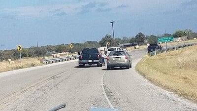 A damaged road sign is seen after a police chase near Sutherland Springs, Texas, U.S., November 5, 2017, in this picture obtained from social media. Liz Summers/via REUTERS THIS IMAGE HAS BEEN SUPPLIED BY A THIRD PARTY. MANDATORY CREDIT.NO RESALES. NO ARCHIVES