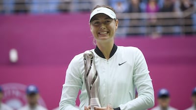 Maria Sharapova holds her trophy after winning her women's singles final match against Aryna Sabalenka at the Tianjin Open. Wang Zhao / AFP