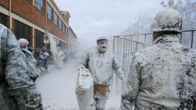 Revellers covered in flour celebrate the traditional Els Enfarinats (the floured ones) festival at Ibi, Alicante, Valencia, Spain. They stage a mock coup and battle with fireworks, eggs and flour on the Day of the Innocents, a Spanish version of April Fools' Day. EPA