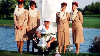 Ernie Els of South Africa with the winner's trophy and Emirates stewardesses after the final round of golf's Dubai Desert Classic in 1994. Getty Images