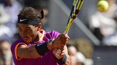 Rafael Nadal returns a ball to Novak Djokovic during their ATP Madrid Open semi-final match in Madrid, on May 13, 2017. Nadal won 6-2 and 6-4. Javier Soriano / AFP