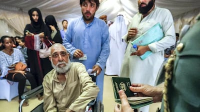 Zahir Janan Abdul Jabar, 60, is given priority by immigration officials at Shahama immigration centre. Victor Besa / The National
