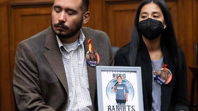 Felix and Kimberly Rubio - parents of 10-year-old Alexandria Rubio who was killed during the shooting at Robb Elementary School in Uvalde, Texas - hold a photo of their daughter during a House Committee on Oversight and Reform hearing in Washington. AFP